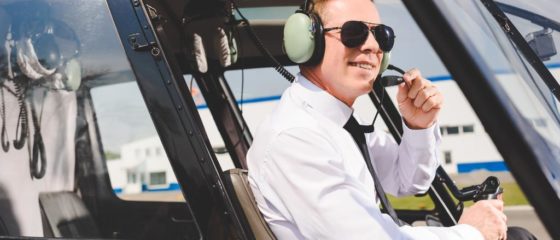 stock-photo-smiling-pilot-sunglasses-headset-sitting